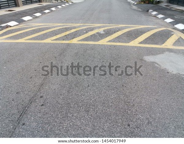 asphalt bump for vehicle\
to slow down.