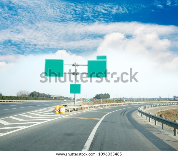 Asphalt car
road and clouds on blue sky in summer
day