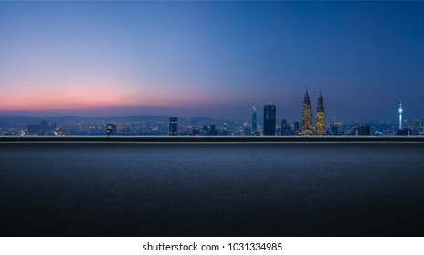 Asphalt Empty Road Side With   Kuala Lumpur City Skyline Background . Night Scene .