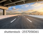 Asphalt highway road and bridge with modern city buildings scenery at sunset in Shenzhen, China. Urban road background.