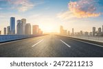 Asphalt highway road and city skyline with modern buildings at sunrise in Chongqing. Panoramic view.