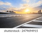 Asphalt highway road and city skyline with modern buildings at sunset. car background.