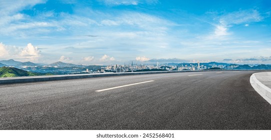 Asphalt highway road and city skyline with green mountain scenery in Shenzhen. Panoramic view. - Powered by Shutterstock