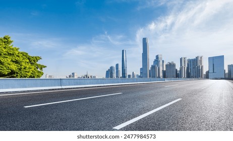 Asphalt highway road and city skyline with modern buildings scenery in Guangzhou. Car background.