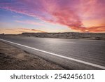 Asphalt highway road and desert with beautiful sky clouds natural landscape at dusk. Road trip.