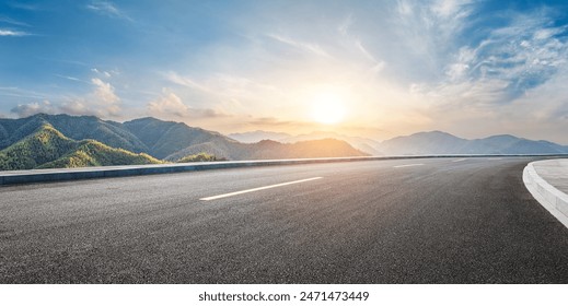 Asphalt highway road and green mountain with sky clouds at sunset