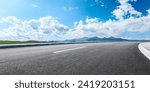 Asphalt highway road and mountain nature landscape under blue sky. Panoramic view.