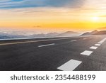 Asphalt highway road and mountain with skyline scenery at sunrise