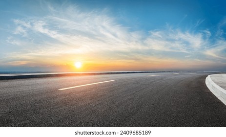 Asphalt highway road and sky clouds at sunset - Powered by Shutterstock