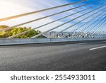 Asphalt highway road and suspension bridge with modern city skyline scenery in Shenzhen. Outdoor road background.