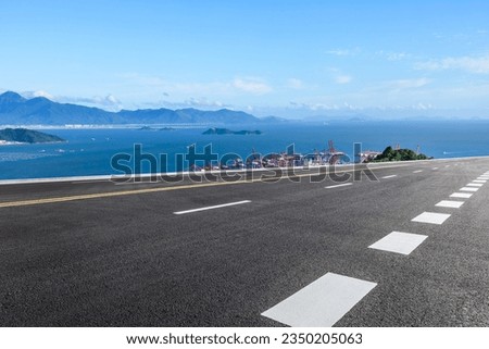 Asphalt highway and sea with island natural landscape in summer