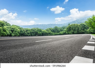 Asphalt highways and mountains under the blue sky - Powered by Shutterstock