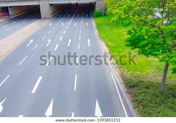 Asphalt main road for cars with arrows, empty\
highway way, autobahn