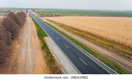 Asphalt New Road Along The Fields,  Road Seen From The Air. Aerial View Landscape. Dron  Photography.