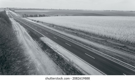 Asphalt New Road Along The Fields,  Road Seen From The Air. Aerial View Landscape. Dron  Photography.