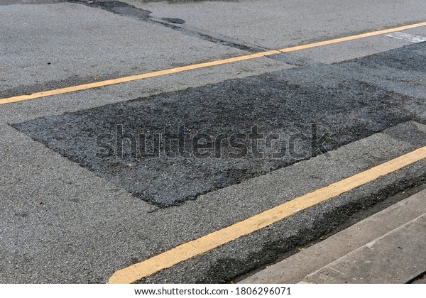 asphalt on old
street and line sign on
street
