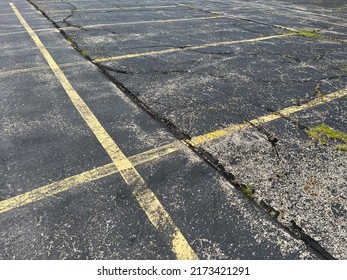 Asphalt Parking Lot In Need Of Repair.