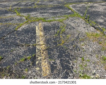 Asphalt Parking Lot In Need Of Repair.