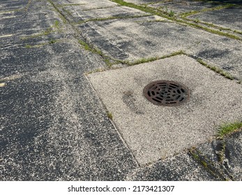 Asphalt Parking Lot In Need Of Repair.