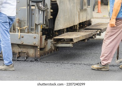 Asphalt Pavement Works. Asphalt Paving Machine. 