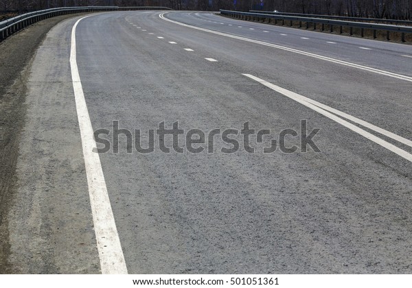 asphalt paving on\
highway turn a close up