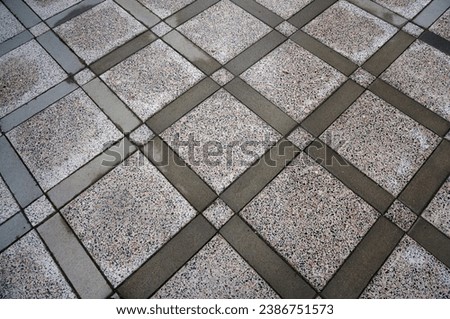 Asphalt, paving slabs. Floor masonry, bricks. Sidewalk. Dirt road underfoot. Background tiles                               