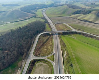 Asphalt Road Among The Green Hills Aerial View