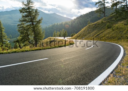 Asphalt road in Austria, Alps in a beautiful summer day, Hochalpenstrasse.
