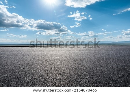 Asphalt road and beautiful sky cloud landscape under blue sky