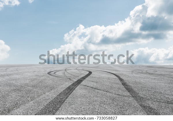 Asphalt
road circuit and sky clouds with car tire
brake