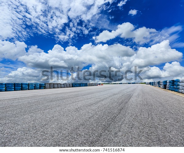 Asphalt
road circuit and sky clouds with car tire
brake