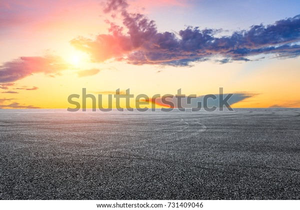 Asphalt\
road circuit and sky sunset with car tire\
brake