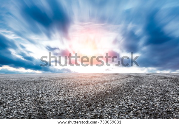 Asphalt\
road circuit and sky sunset with car tire\
brake