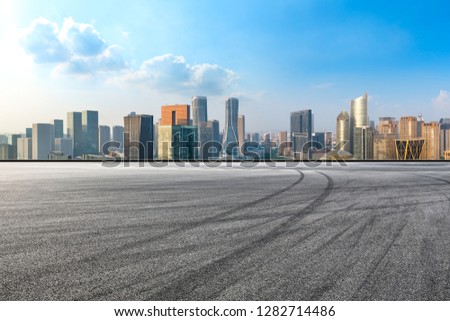 Asphalt road and city skyline in hangzhou,high angle view
