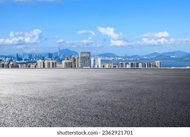 Asphalt road and city skyline with modern buildings in Shenzhen, Guangdong Province, China. 