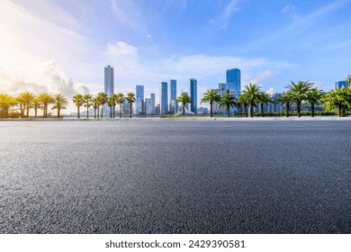 Asphalt road and city skyline with modern buildings under blue sky - Powered by Shutterstock