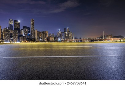 Asphalt road and city skyline with modern buildings scenery at night in Chongqing - Powered by Shutterstock