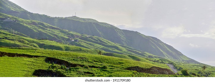 An Asphalt Road Cross The Treacherous Mountainous Landscape Found On The Island Of Fogo, As It Traverses Through The Village Of Sao Jorge