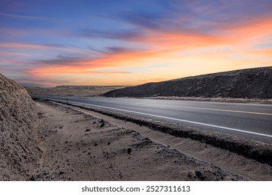 Asphalt road and desert with sky clouds nature landscape at dusk. Road trip. - Powered by Shutterstock