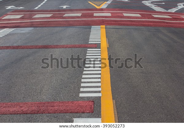 Asphalt road with dividing lines and tire tracks.\
Background photo\
texture