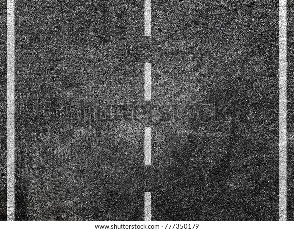 Asphalt road with dividing
white line.