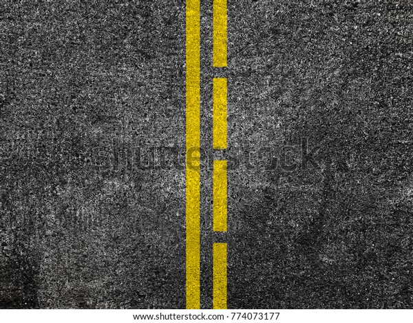 Asphalt road with\
dividing yellow lines