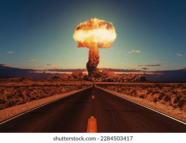 Asphalt road goes to a nuclear explosion. Terrible atomic explosion of a nuclear bomb with a mushroom cloud of radioactive dust. Hydrogen bomb test. Nuclear catastrophe. Way to nuclear war