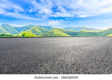 Asphalt road and green mountain with bamboo forest natural landscape. - Shutterstock ID 1864360543