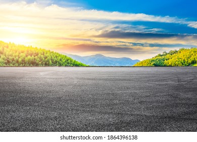 Asphalt road and green mountain with bamboo forest natural landscape at sunset. - Shutterstock ID 1864396138