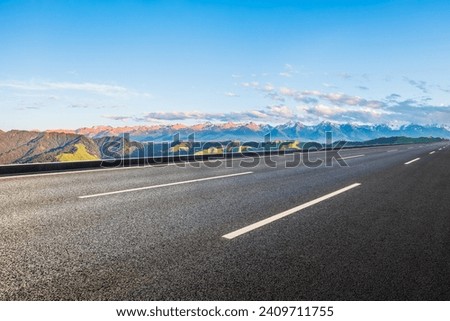Asphalt road and green mountain with sky clouds nature landscape at sunset