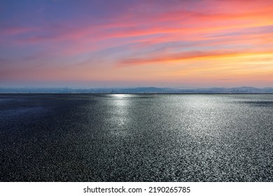 Asphalt road ground with colorful sky clouds at sunset. high angle view. - Shutterstock ID 2190265785