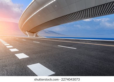 Asphalt road highway is by the seaside - Powered by Shutterstock