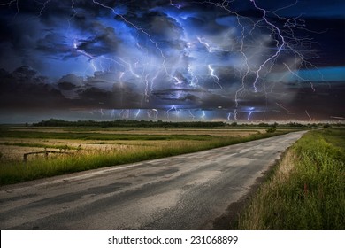 Asphalt Road And Lightning Storm