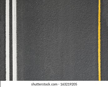 Asphalt road with marking lines. Close-up background texture - Powered by Shutterstock